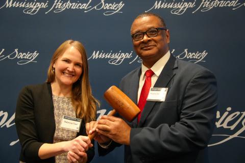 Pictured: Rebecca Tuurri completes her term as president of the Mississippi Historical Society and hands the gavel to Roscoe Barnes III during the group's 2025 Annual Meeting.